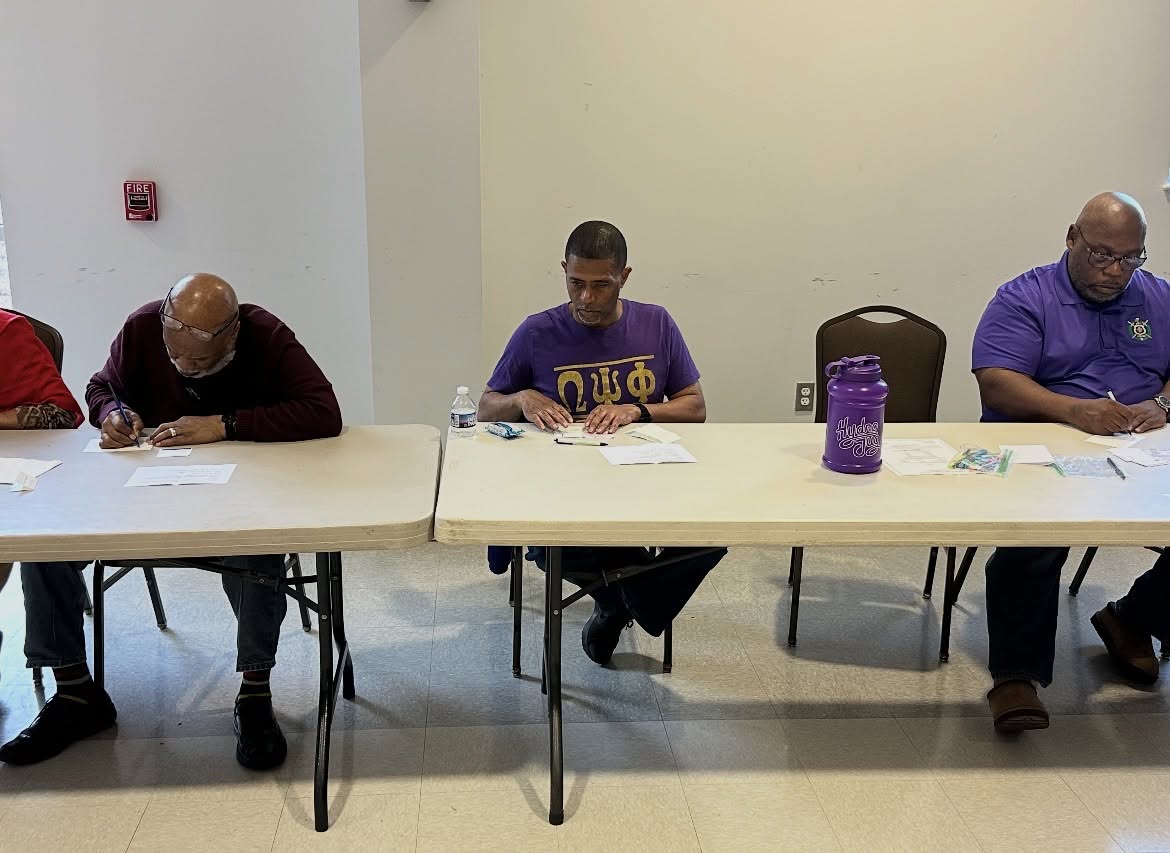 Community members participating in a voter registration drive